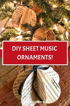 an ornament made out of sheet music sits on top of a christmas tree