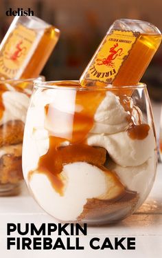 pumpkin fireball cake in a glass with caramel syrup and whipped cream on top