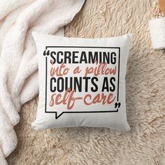 a pillow that reads, screaming into a pillow counts as self - care on it