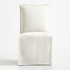 an upholstered white chair on a white background