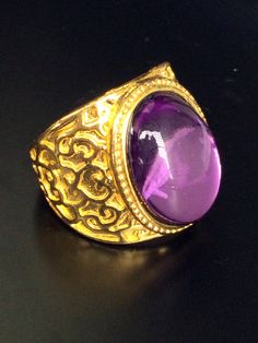 This is a very rare and perfect and unique magic ring made purple naga eye stone and silver gold plated, the power of the ring is to bring good luck and charm to the wearer. The ring showcases an elegant design with unique amulet style ring. It is great to get this ring for your loved one or treat yourself for a classic timeless style.  Ring US Size: 9,  Metal Type: silver gold plated,  Weight: 17.64 Gram (Approx.) The Belief about purple naga stone; Purple means the mysterious power associated Stone Magic, Silver Gold Ring, Ring Purple, Timeless Classic Style, Magic Ring, Gold And Silver Rings, Eye Stone, Rings Statement, Types Of Metal