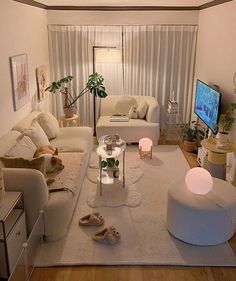 a living room filled with furniture and a flat screen tv