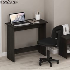 a computer desk with a laptop on it