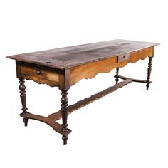 an old wooden table with two drawers on one side and a drawer on the other