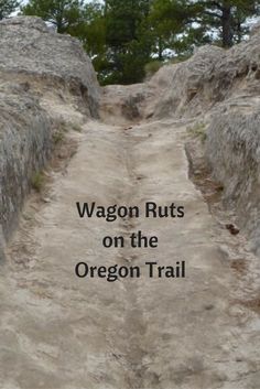 a dirt path with the words wagon ruts on the oregon trail written in black