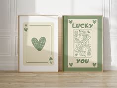 two framed cards with the words lucky and i love you in green ink on them