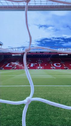 a soccer field with the goalie's net in view