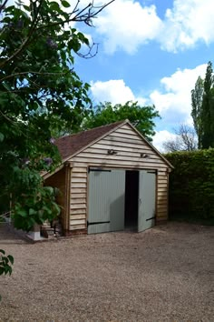 an outhouse with a shed in the middle