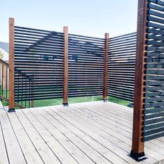 an outdoor deck with wooden slats on it