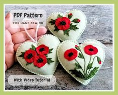 three heart shaped felt ornaments with red flowers on them, and the words free pattern for hand sewing