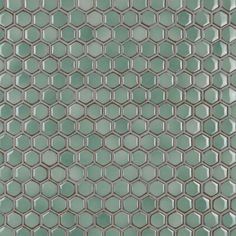 a close up view of the glass mosaic tile in this bathroom wallpapered with hexagon tiles