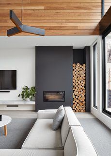 a living room with couches and a fire place