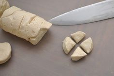 a knife and some cut up food on a table