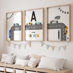 three framed pictures hang on the wall above a bench in a child's room