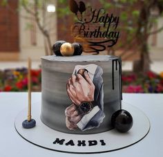 a birthday cake decorated with an image of a man's hand