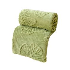 a green towel with an embroidered design on it's side and the bottom rolled up