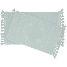 two light green towels with tassels on each side, one in white and the other in grey