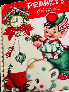 an old children's christmas book with a little boy holding a pine cone in his hand