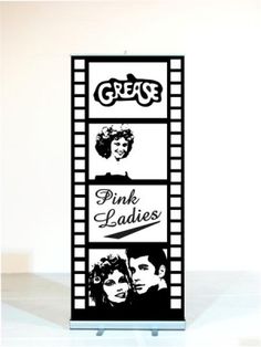 a film strip with the words grease and pink ladies on it, in front of a white background