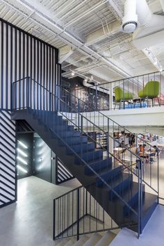 an office building with stairs leading up to the second floor