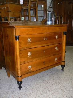 an old wooden dresser sitting on top of a floor