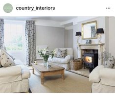 a living room with couches, chairs and a fire place in the fireplace area