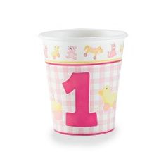 the first birthday cup is pink and white checkered with an animal design on it