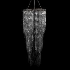 a crystal chandelier hanging from a ceiling in the shape of an umbrella, on a black background