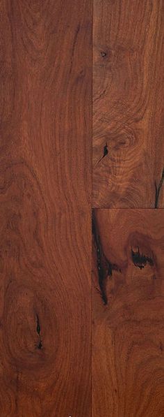 closeup of the wood grains on this wooden flooring project, with dark brown stain