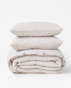 three pillows stacked on top of each other