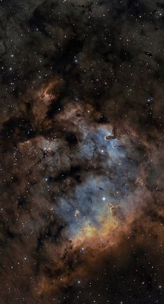 an image of the sky with stars and clouds in it, as seen from space