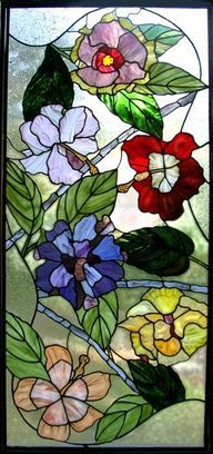 a stained glass window with flowers on it