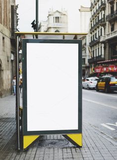 an empty bus stop on a city street