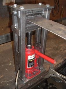 a red fire extinguisher sitting on top of a metal shelf