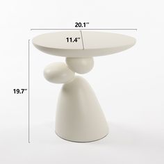 a white table with measurements for the top and bottom portion on it's side