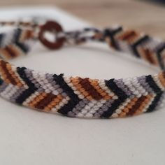 a close up of a bracelet on a table