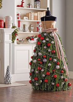 a mannequin dressed in a christmas tree dress