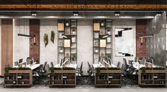 an office with multiple desks and chairs in front of a wall mounted bookcase