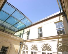 there is a glass roof in the middle of this building