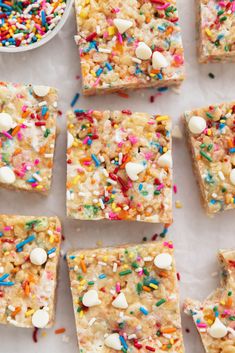 several pieces of rice krispy treats with sprinkles and candy on top