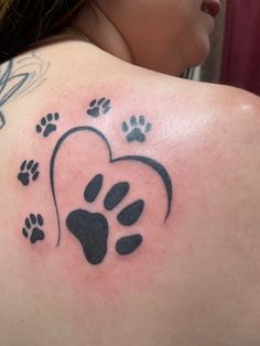 a woman with a heart and paw prints on her back