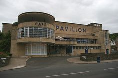 an old building that has been converted into a cafe pavillon on the corner