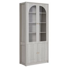 a tall white cabinet with glass doors