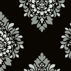 black and white wallpaper with floral designs on the back in shades of grays