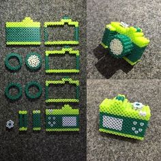 some type of green and white object made out of legos on the floor with other items