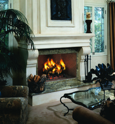 a living room filled with furniture and a fire place in the middle of the room