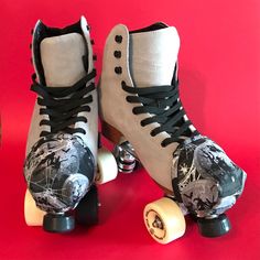 two roller skates with black and white designs on them