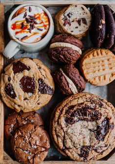 an assortment of cookies and pastries on a tray