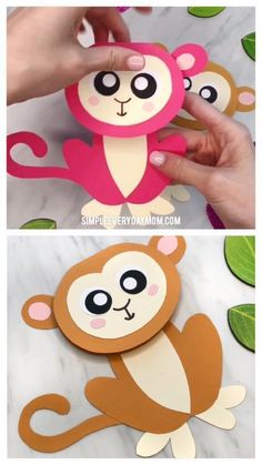 someone is making a monkey out of paper and then it's cut out with scissors