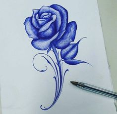 a drawing of a blue rose on white paper